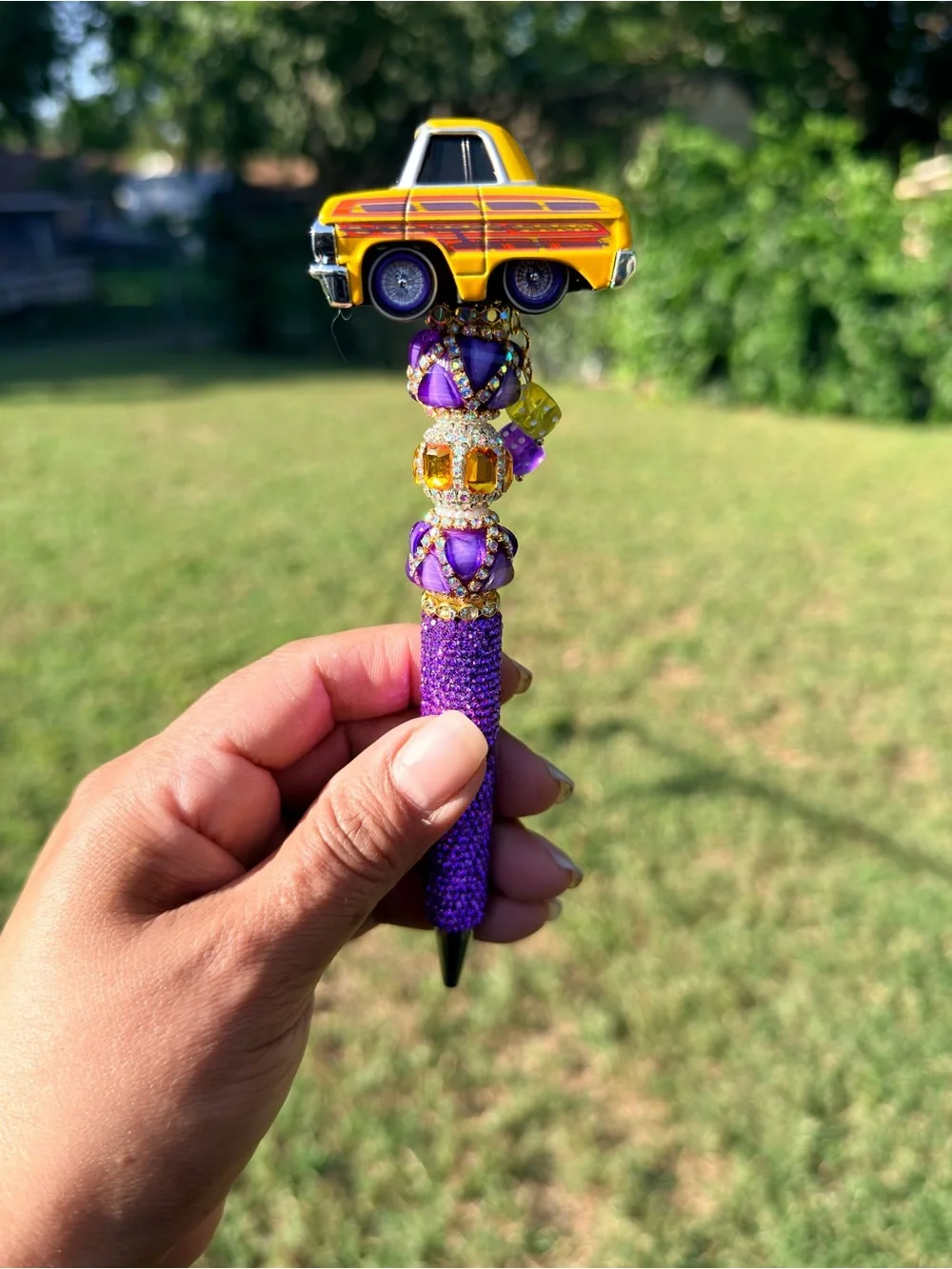 Lowrider 64 Impala Car Tuned Topper Pen with Purple and Yellow Accents.